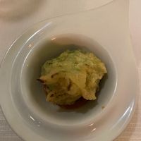 Steamed broccoli in a light tempura batter laid on a fresh cherry tomato sauce.  at Ristorante Da Mario alla Fava in Venice