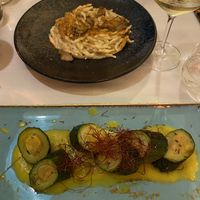 Pasta with a creamy artichoke sauce and on the bottom was a zucchini with chickpea filling with a generous layer of saffron on top    at Ristorante Da Mario alla Fava in Venice
