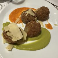 Sfere di melanzane su vellutata di zucchine e pomodoro con scaglie di grana vegano  at Ristorante Da Mario alla Fava in Venice