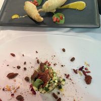 Deep fried pumpkin blossoms (top) and zucchini avocado tartare (bottom)  at Ristorante Da Mario alla Fava in Venice