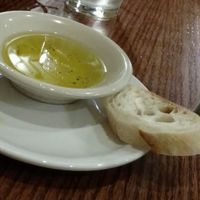 Bread is NOT Vegan. I had to listen to my stomach growl, while my husband are bread. They serve a vegan sandwich on bread.....multi use not utilized. at Soup Spoon Cafe in Lansing