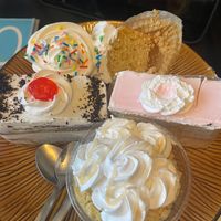 Chocolate & vanilla cake slices, cupcakes and mango drizzled cake cup.  at Rashmi's Bakery in Brampton