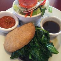 portobello mushroom burger, sautéed spinach on homemade wheat bread at 2 Dog Cafe in Gainesville