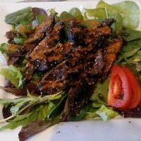 mushtook steaks over greens   at Lov'n It Live in East Point