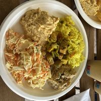 Hummus, riso al latte di cocco e curry, tofu al curry con verdure, seitan con salsa ai funghi e insalata di cavolo e carote con maionese   at Ravegan Gastronomia in Ravenna