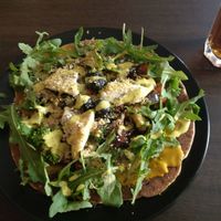 Gluten free pizza and black ice tea at Vegan Inspiratsioon in Tallinn