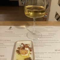 Compliments of the kitchen, air bread with vegan feta and crispy tomatoes   at Romeow Cat Bistrot in Rome