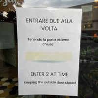 Funny sign at the entry to keep cats in   at Romeow Cat Bistrot in Rome