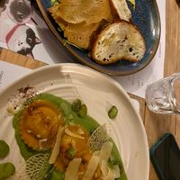 Sliced seitan dish and ravioli at Romeow Cat Bistrot in Rome