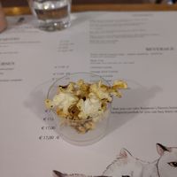 Popcorn with curry served as a free appetizer at Romeow Cat Bistrot in Rome