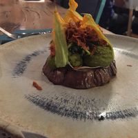 Roasted eggplant with Brazilian nuts and basil cream, marinated courgettes, courgette flowers and carrot chips at Romeow Cat Bistrot in Rome