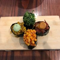 This is their "Piece Sampler" all served with black rice:
- Charred corn with harrisa and cilantro.
- Curried cauliflower with almond pesto.
- Roasted tomato with tomato guajillo.
- Seaweed salad with chili flakes and sesame seeds.
All were delicious but my favorites were the Charred corn and the Curried cauliflower. Only costed $6! at Beyond Sushi in New York City