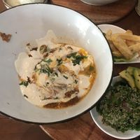 Shakshuka lunch which comes with fries and tabouli. Portion is very very small but tasty. COP 35,0000    at Ikaro Cafe in Santa Marta