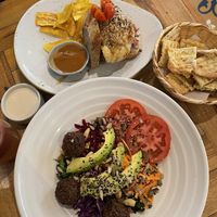 Cauliflower steak sanga & falafel rainbow salad  at Ikaro Cafe in Santa Marta