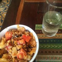 Homemade granola and cereal with fruits and almond milk   at Ikaro Cafe in Santa Marta