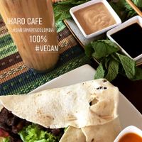 Burrito, almond milk latte and Vietnamese rolls @ edtatton85 on instagram  at Ikaro Cafe in Santa Marta