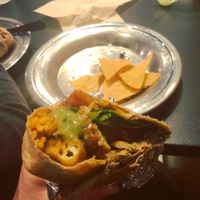 Tofu and spinach burrito with added vegan chili topped with avocado salsa. at Dos Amigos in Concord