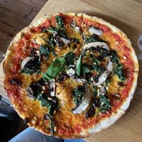 Vegan pizza with mushrooms, spinach, pine nuts and caramelised onions at The Bird Cage in Malmesbury