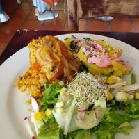 Stuffed tomato, mashed potatoes with beet cream, salad at Prana in Envigado