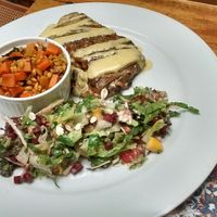 Bean & eggplant burrito, salad, carrots with grains at Prana in Envigado