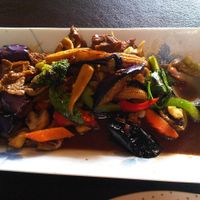 Pad-Khing-Jay: Stir fry with seitan ‘roasted duck,’ grilled eggplant, baby corn, bell pepper, mushroom, cabbage, and carrot, topped with chili sauce and sweet Thai basil at Lemon Grass in Livermore