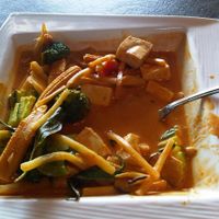 Gang-Pak curry: Red coconut curry with of tofu, Thai herbs, sweet Thai basil, baby corn, zucchini, broccoli and bamboo shoots at Lemon Grass in Livermore