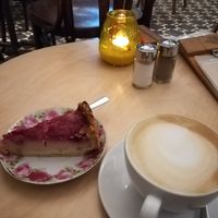 Cherry cheesecake with oatmylk cappuccino at Valladares in Berlin
