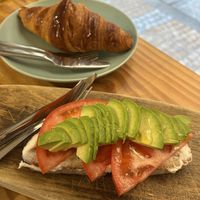 Tostada (queso, aguacate y tomate) y croissant  at Bohemian Lane in Bilbao