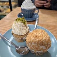 Cupcakes (pistachio and almond/apricot) and hot chocolate with cream at Bohemian Lane in Bilbao