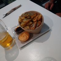 Patatas fritas con salsas a elegir (barbacoa y Kimchi son las de la foto) at El Oju in Granada