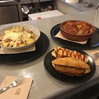 Patatas con baicon y queso, albóndigas en salsa, choripan y tapa de tortilla de patatas at El Oju in Granada