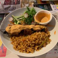 Fried tofu and mushroom with satay sauce, Indonesian fried rice and salad at Mezzaluna in Saint-laurent-blangy