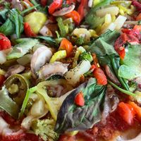 Closer image of pizza-not a lot of vegan cheese is visible at Blaze Pizza in Gainesville