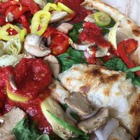 Veg Out Pizza with vegan cheese with red sauce dollops at Blaze Pizza in Gainesville