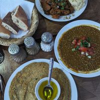 Lentils, lentil crepe, platter (hummus, salad & Zalouk) with free bread at Marrakech Henna Art Cafe in Marrakech