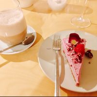 Raw vegan Raspberry cheese cake and hot latte tea with almond milk at Mantra Raw in Milan
