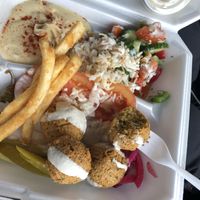 Falafel plate with Lebanese salad, hummus, and fries (and stole some rice from my husbands plate!) at D's Mediterranean Grill in Waco