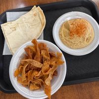 Pita bread and hummus with complimentary pita chips at D's Mediterranean Grill in Waco
