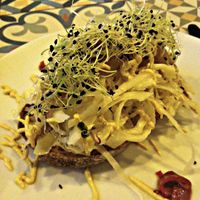 Toast with sauted cabbage, roasted onions and sprouts at VEGA - Luna in Madrid