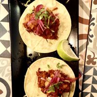 Tacos de jackfruit al pastor con piña asada, @
cebolla encurtida y lima en tortilla de maíz  at VEGA - Luna in Madrid