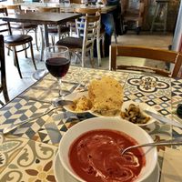 a very flavourful beetroot and strawberry gazpacho, aperitifs and red wine  at VEGA - Luna in Madrid
