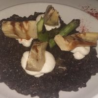 Black rice with "squid", artichokes, asparagus and sweet garlic mayonnaise. at VEGA - Luna in Madrid