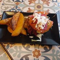 Quinoa burger with homemade wedges at VEGA - Luna in Madrid