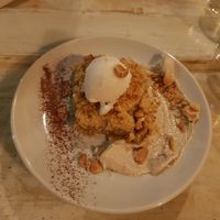 Apple crumble with coconut ice cream at VEGA - Luna in Madrid