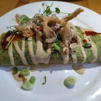 Spinach pancake filled with sweet potato, tofu, and pak choy; miso sauce and crunchy oyster mushrooms as a topping at Hagedis in The Hague