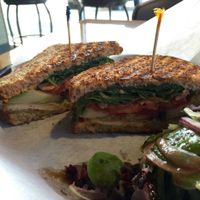 'The Brigitte Bardot' panini (in-house seasoned tofu, cucumber, tomato, avocado, spinach, roasted red pepper sauce, brown mustard on sprouted grain bread). at Mama Jean's Natural Foods Market in Springfield