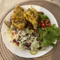 fried seitan with potatoes and side coleslaw and salad  at Edeni Vegan in Budapest