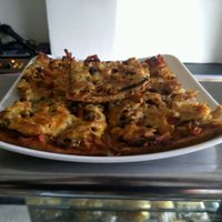 Vegetarian pizza at Veggie Paprika Rice in Bogota