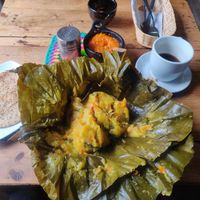 Breakfast tamale with empanada and coffee. at Nativa in Bogota