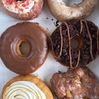 Strawberry shortcake (top left) lemon poppyseed (Top right) chocolate glaze (middle left) chocolate brownie (middle right) lemon meringue (bottom left) apple fritter (bottom right  at Beechwood Doughnuts in St Catharines